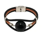 Brazalete con perla , accesorio de piel con cuenta central negra y cierre de acero "